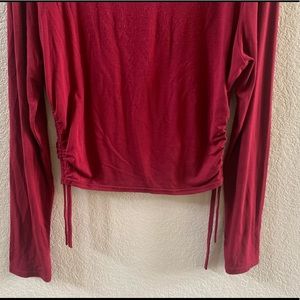 Women’s maroon ruched side long sleeve top
